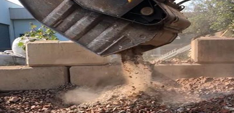 A1 Concrete Recycling concrete with their crusher bucket in Minto, Campbelltown