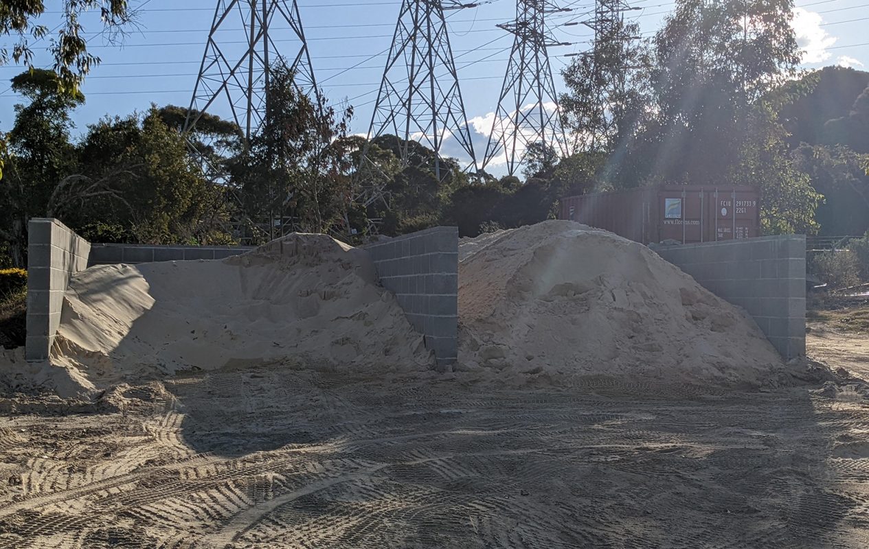 Concrete blocks retaining wall for sand bay on golf course