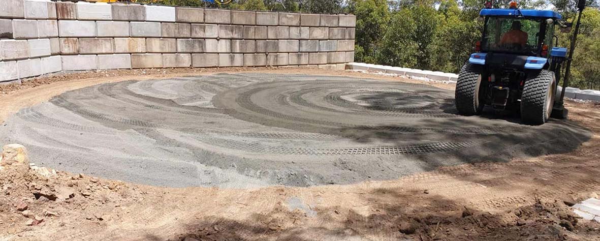 Recycled gravel for base of water tank, Interlocking mortarless blocks, best concrete block curved retaining wall